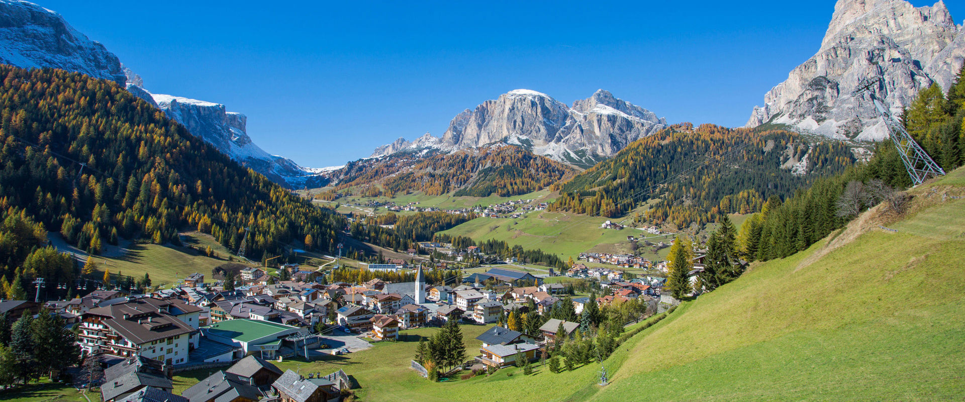 Corvara View of Corvara in dreamy autumn weather with Dolomites mountains