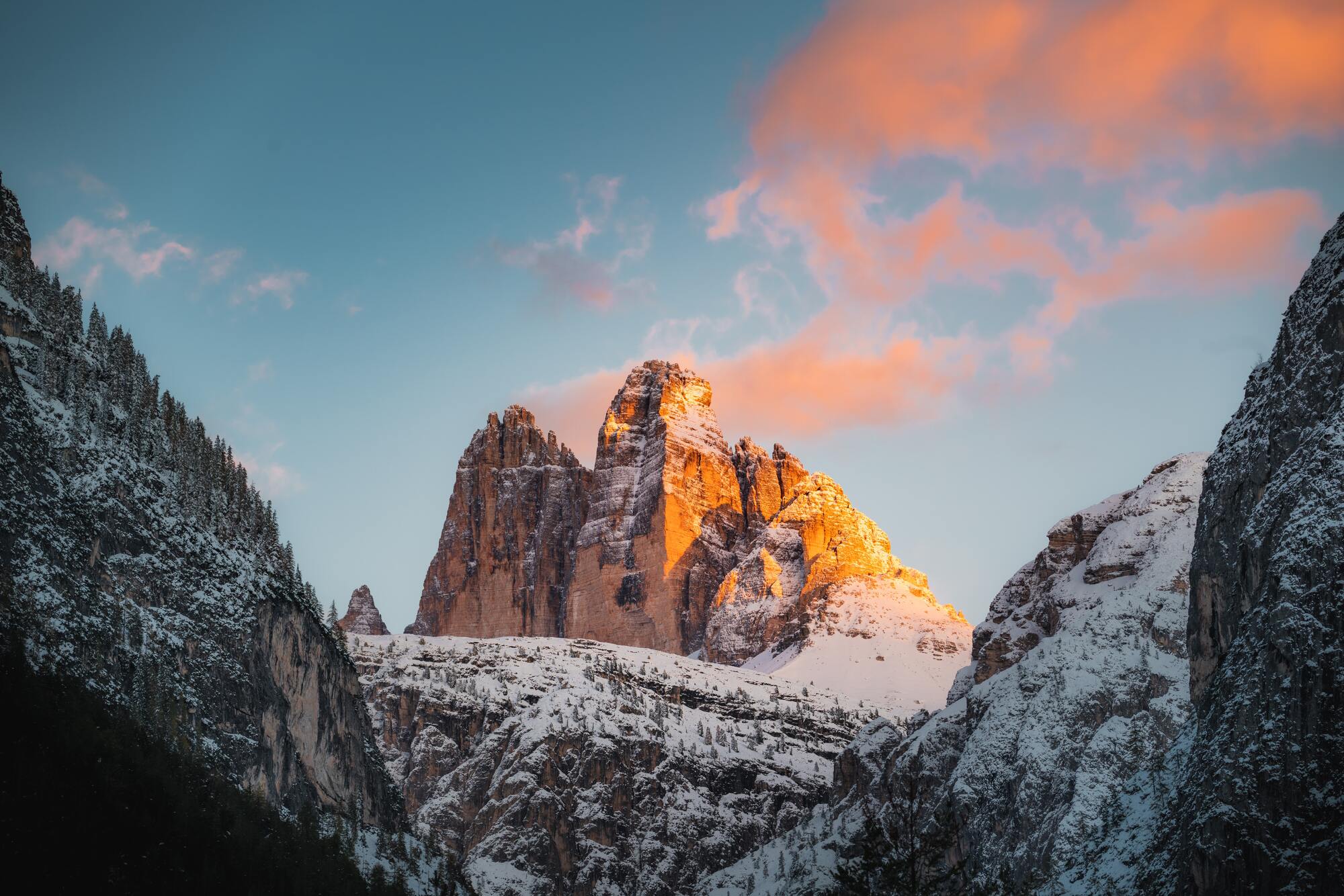 The three Peaks snow-covered at sunset.