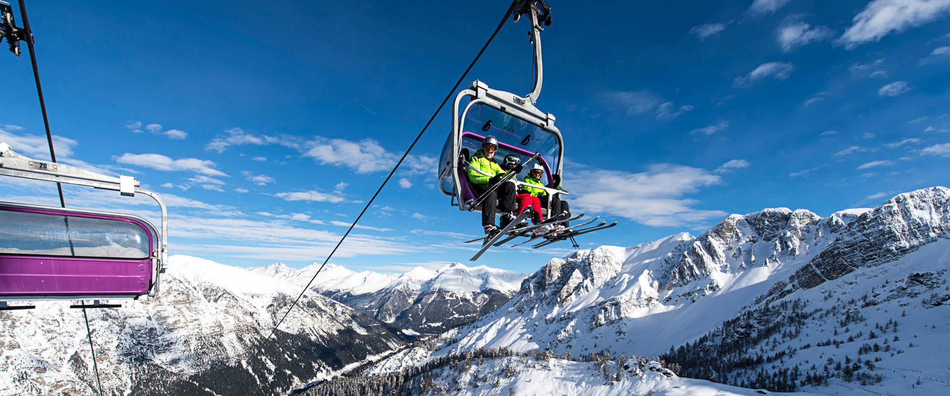 View oft the urrounding snow-covered mountains. View from the chairlift of the surrounding snow-covered mountains.