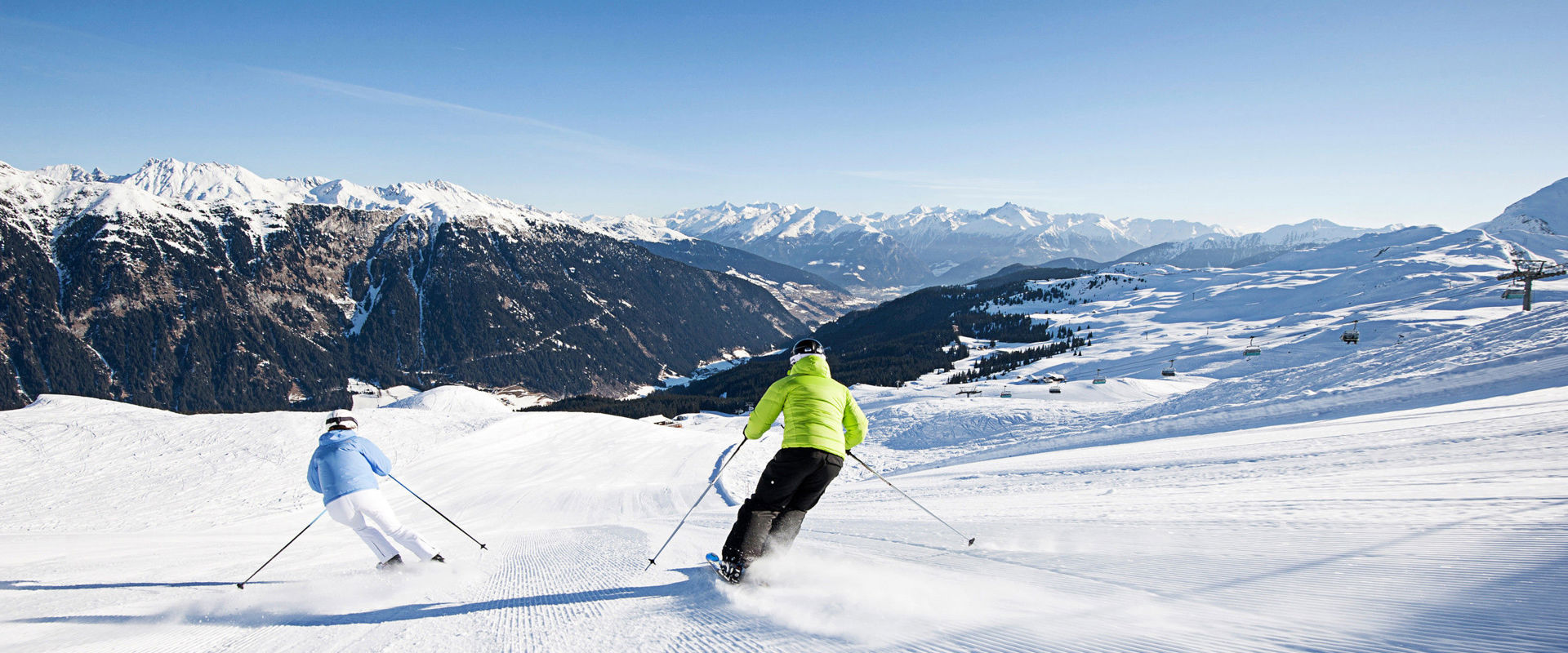 Ski area Ratschings-Jaufen Two skiers riding down the slope.