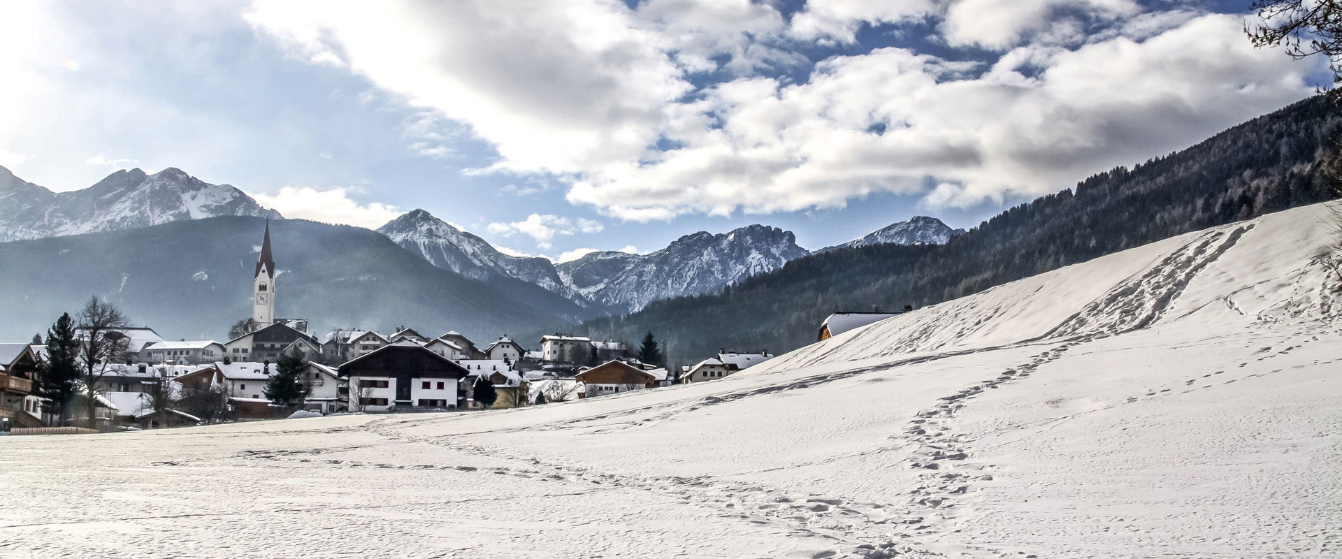 Olang View over Olang with the Dolomites in the background in winter