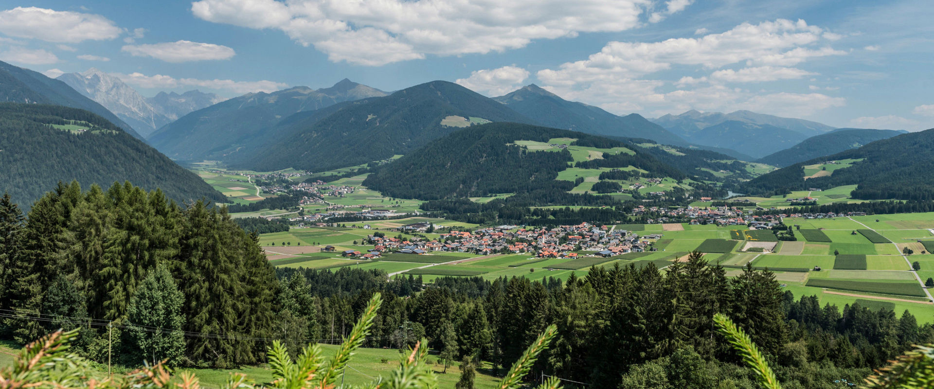 Olang View over Olang with mountains, meadows & woods