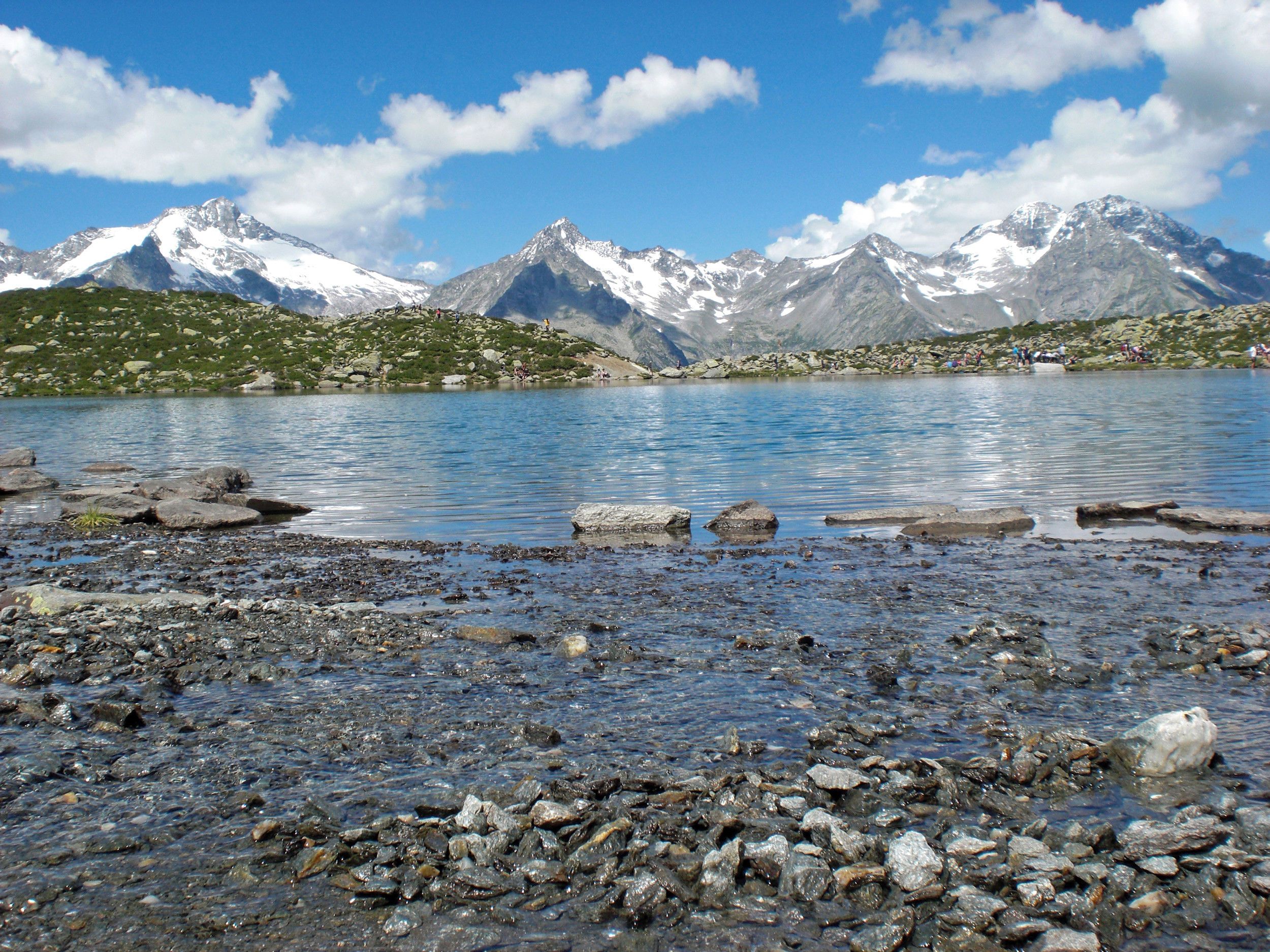 Ice-cold mountain lake in the middle of untouched natural landscape.