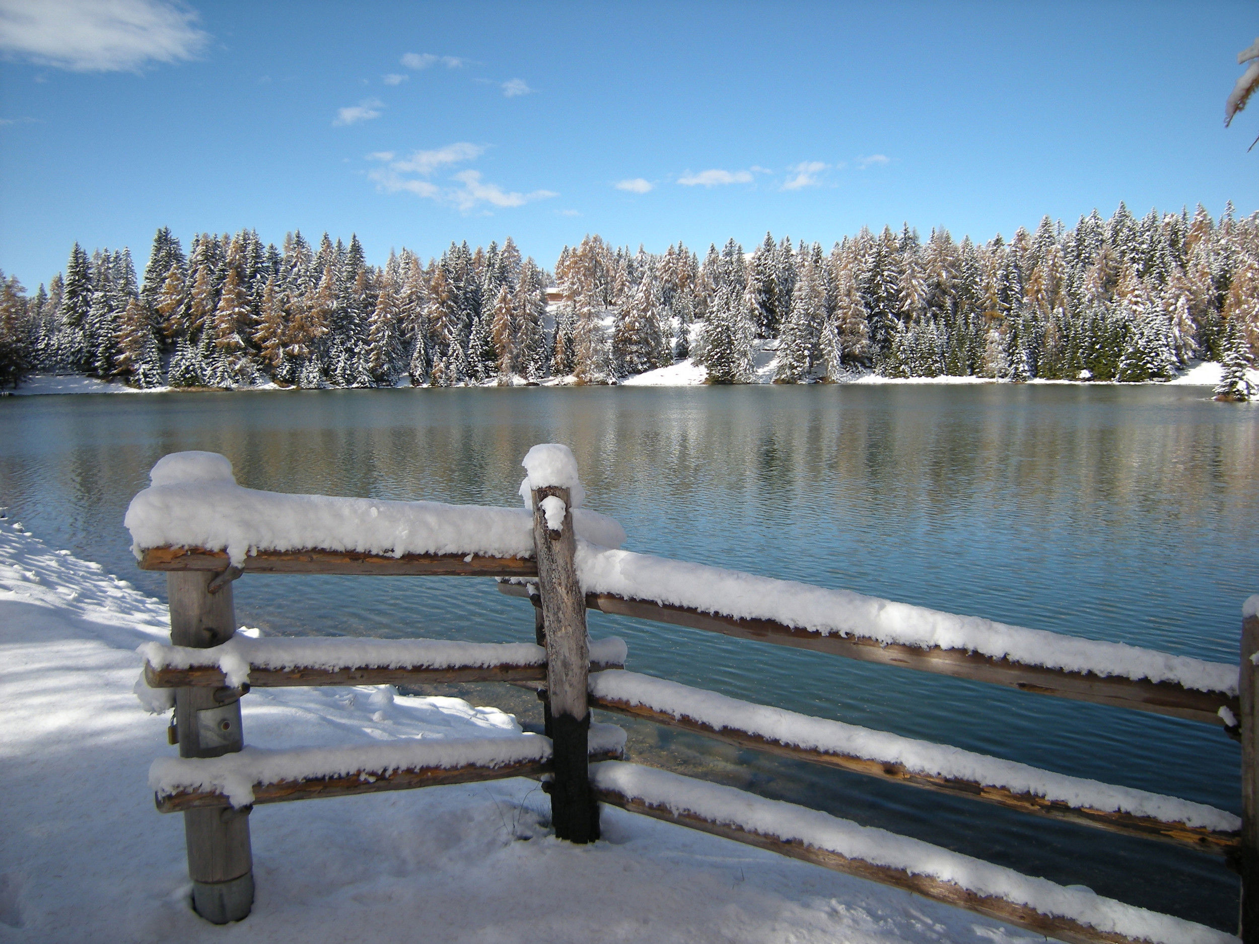 The Felixer Weiher, named Lake Tret as well and the winter landscape covered with snow.