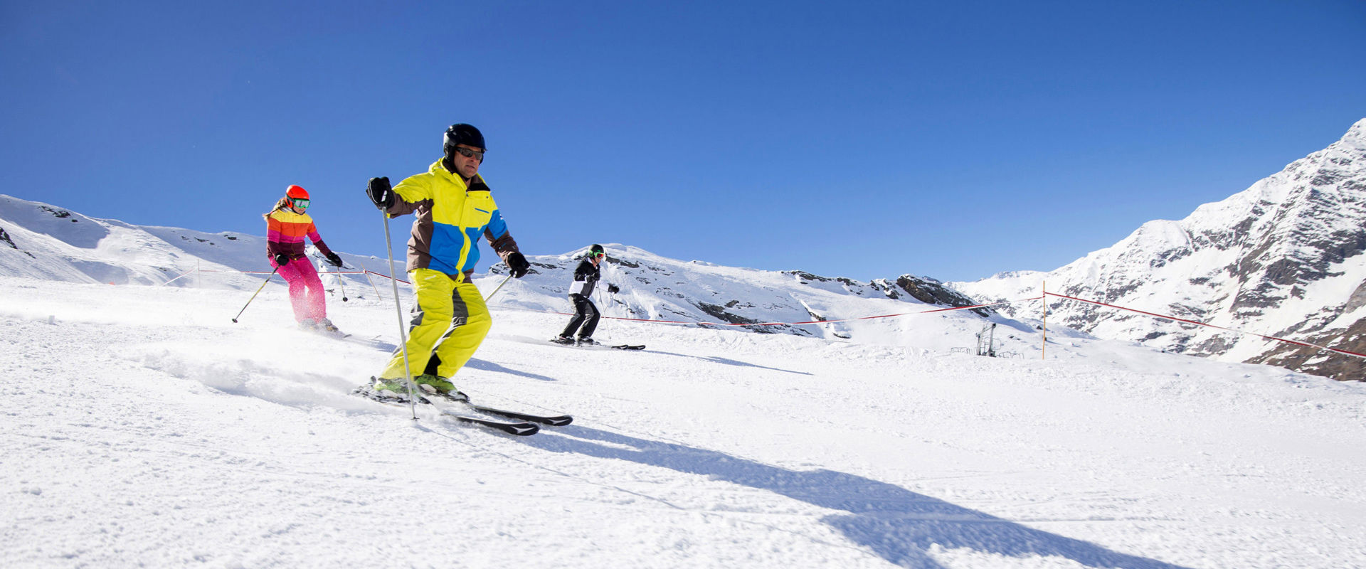 Skiers Skiers go down the slope.