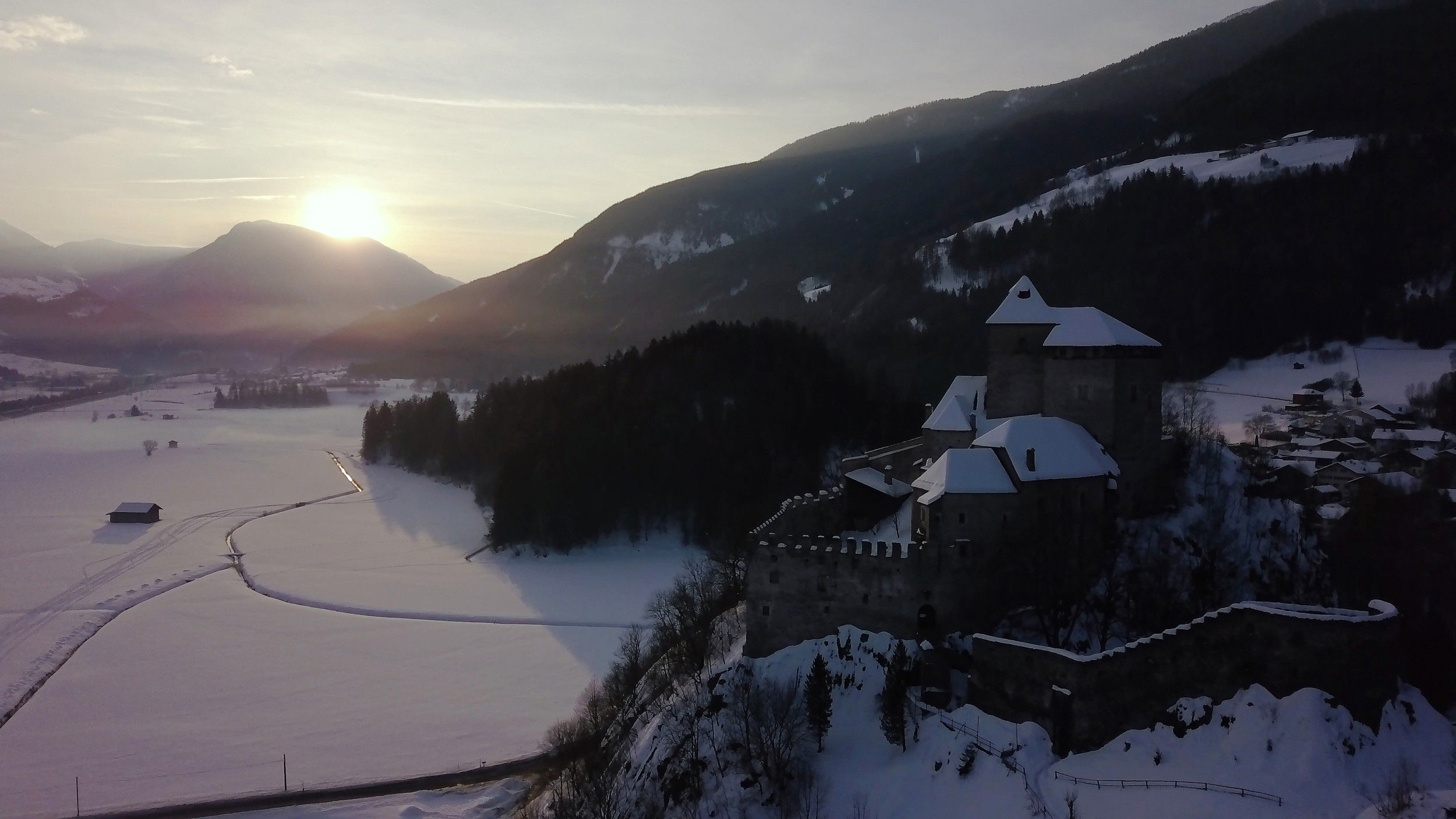 Reifenstein Castle in Freienfeld with sno-covered fields
