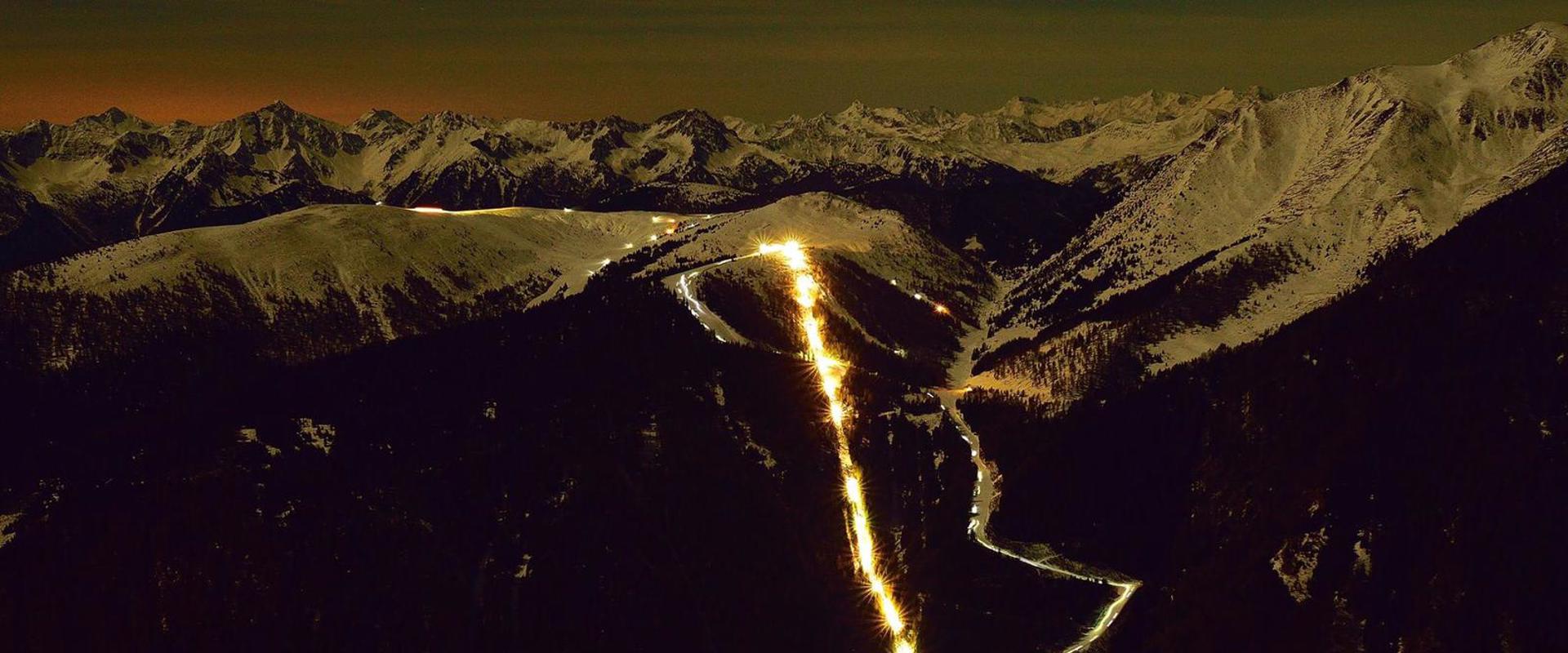 Ski touring evening Jochtal View of the illuminated Jochtal cable car and the wintry mountain world on a ski tour evening.