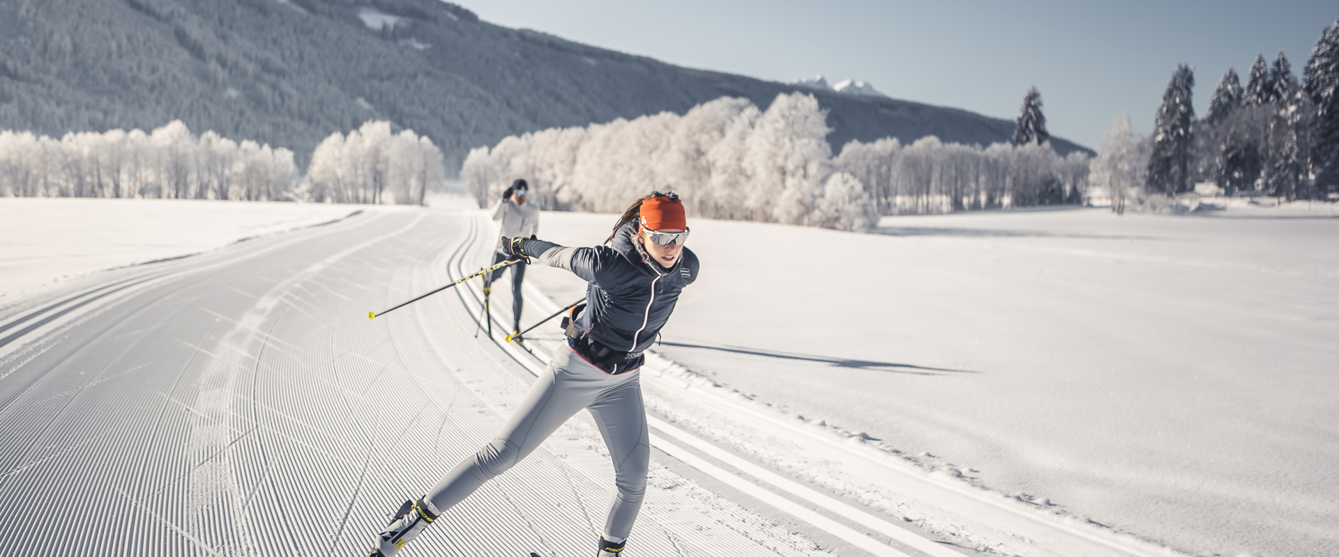 Gsies in winter Snowy landscape in Gsies Valley with cross-country skiers
