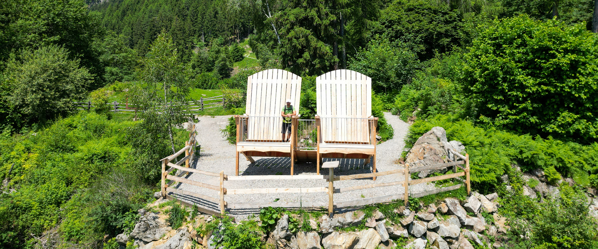 Throne chairs at the Meran high alpine route Viewpoint with 2 huge wooden throne chairs