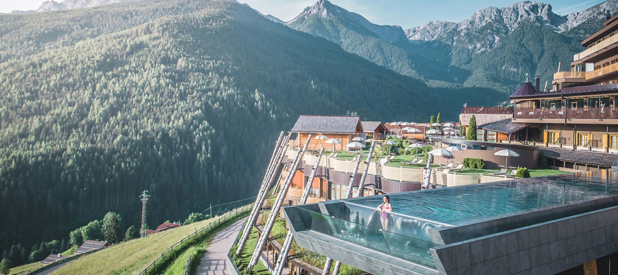 View of the hotel terrace with sky pool and breathtaking views of the mountains.