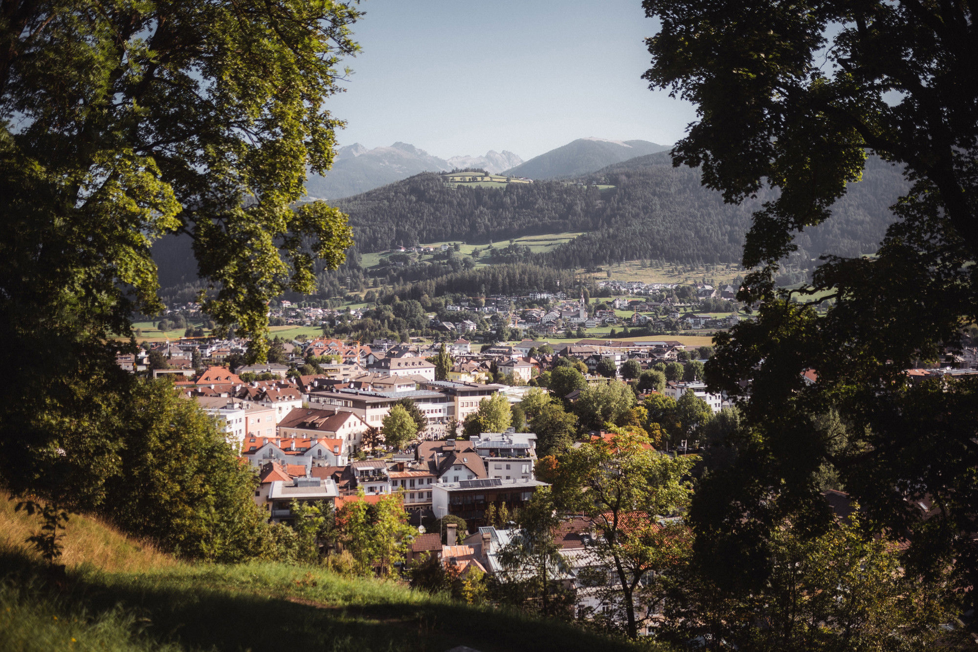 View of the town of Bruneck with mountains in the background