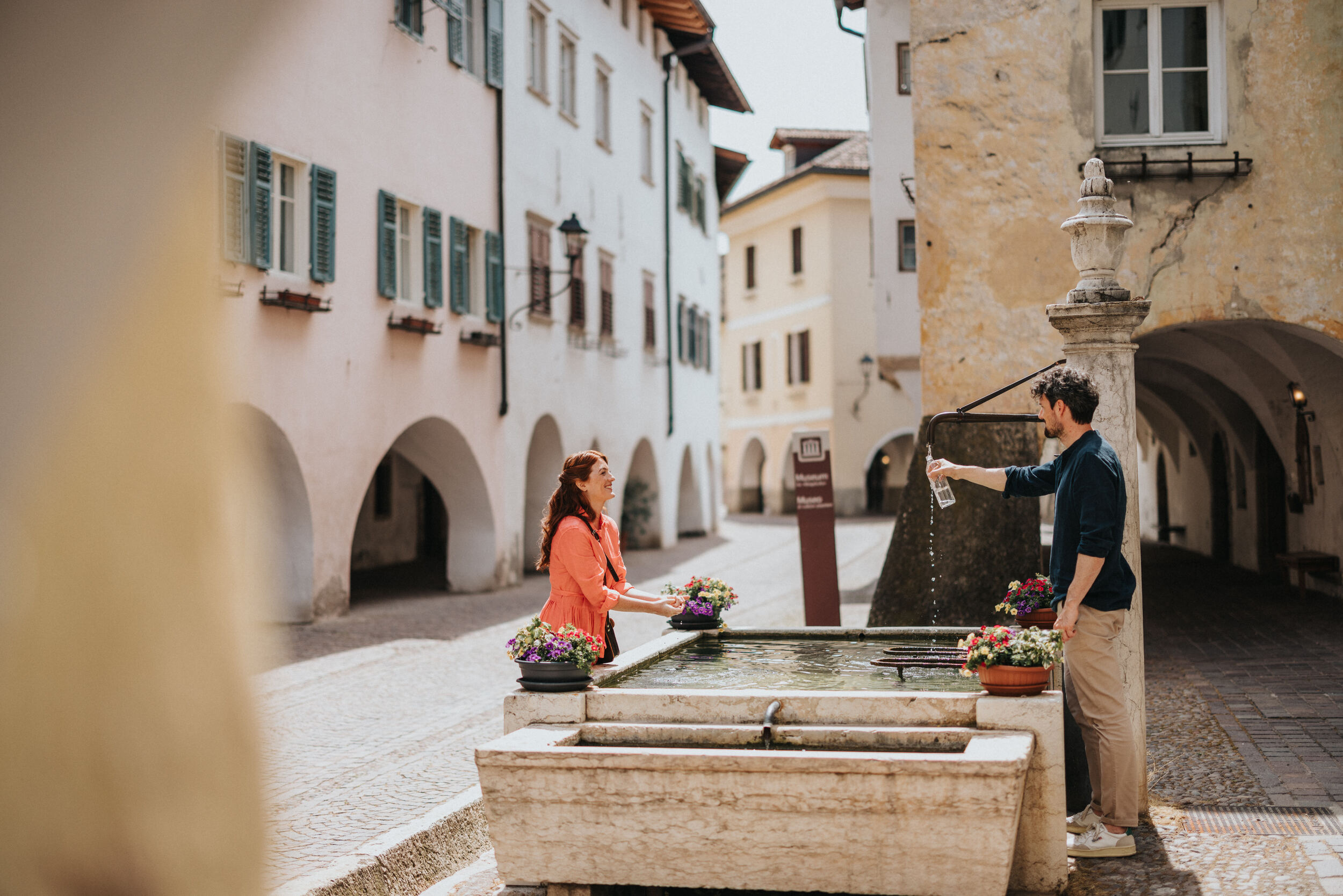 The romantic arcades and fountain in the village of Neumarkt.