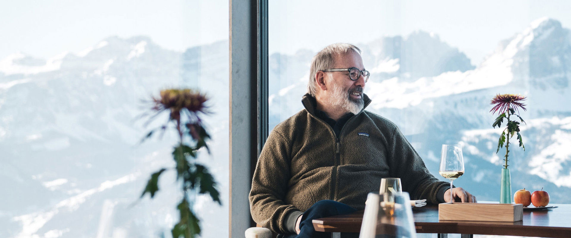 The star chef Norbert Niederkofler sits at a table in the Alpinn restaurant.