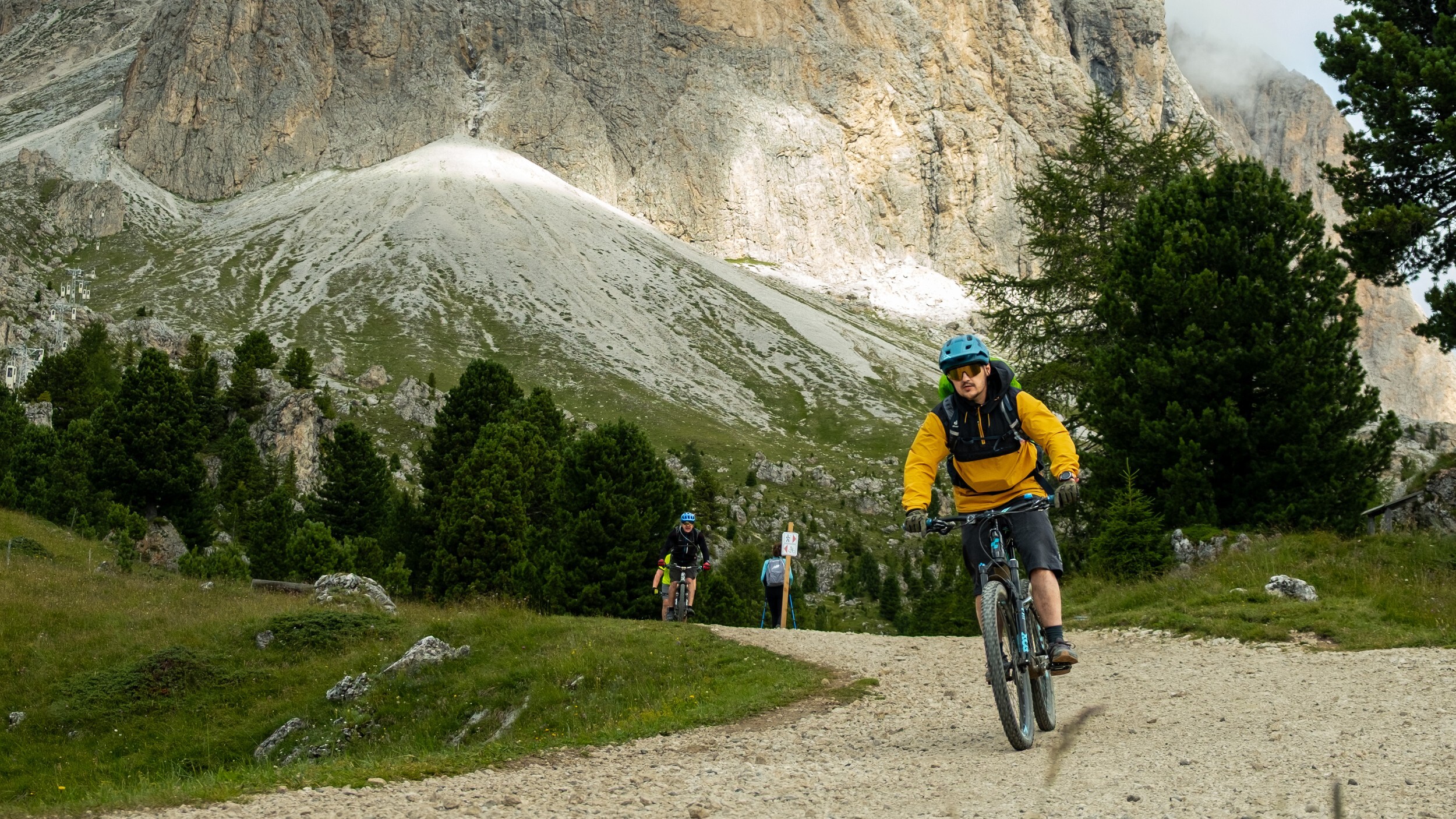 Mountain bikers descending in the Dolomites