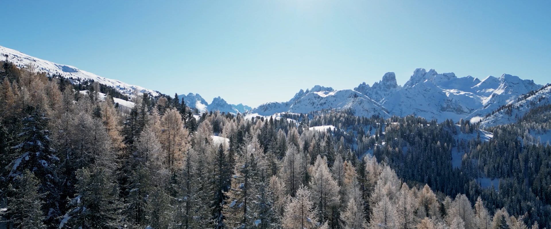 Snow-covered mountain with clear blue sky